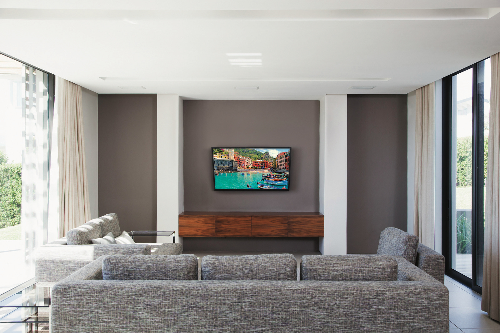floating entertainment center with mounted TV